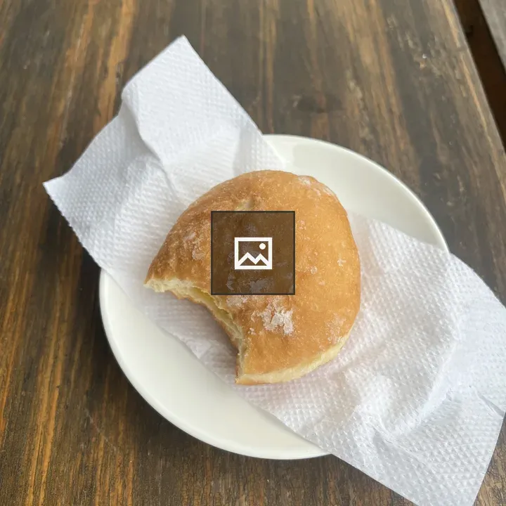 Half-eaten custard doughnut close-up