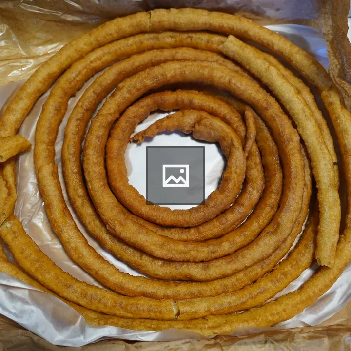 Full wheel of churros on table