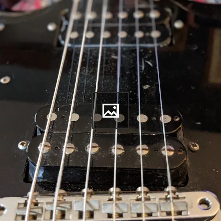 Closeup of black guitar