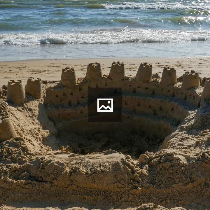 Circular sandcastle on the beach