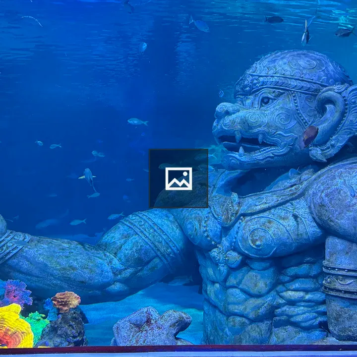 Mossy stone statue underwater