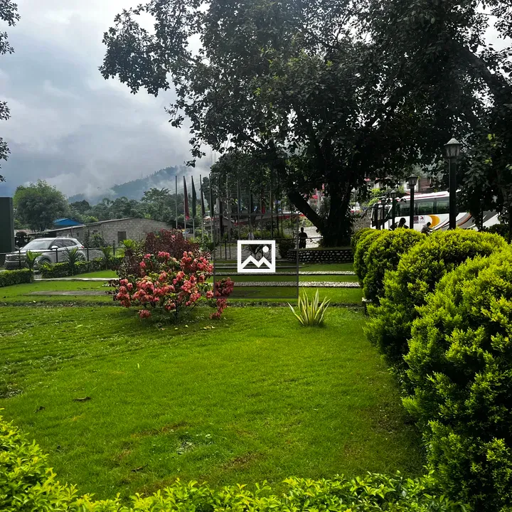 Landscaped garden with trees and building