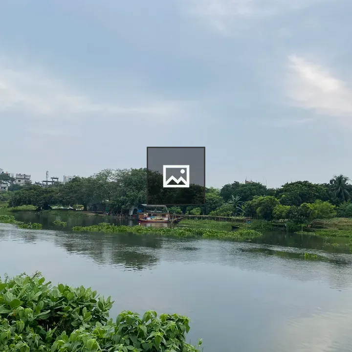 Serene river scene with greenery
