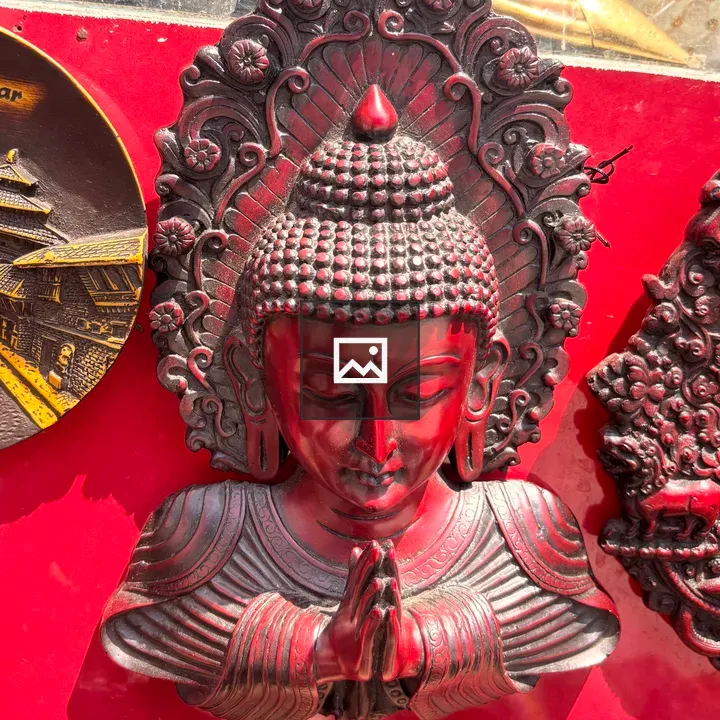Red Buddha wall sculpture