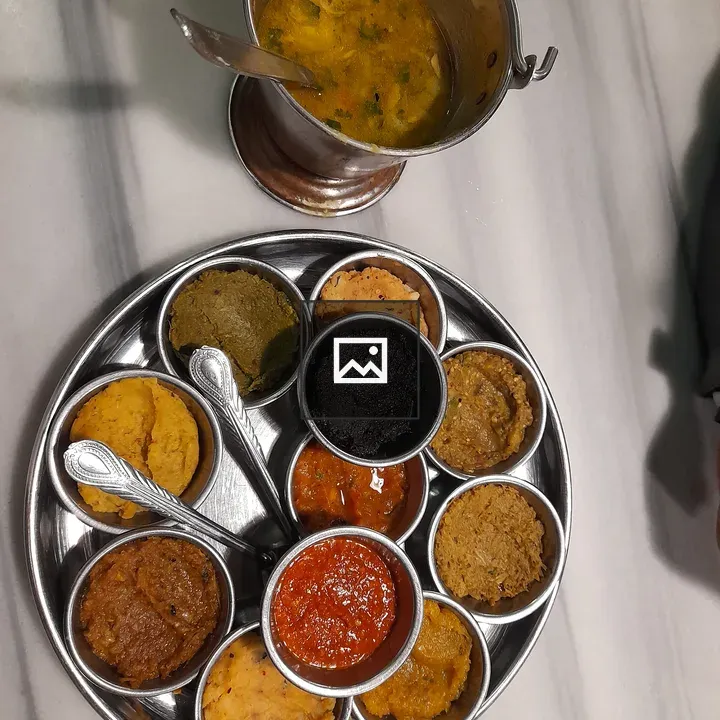 Stainless steel thali with eight dishes