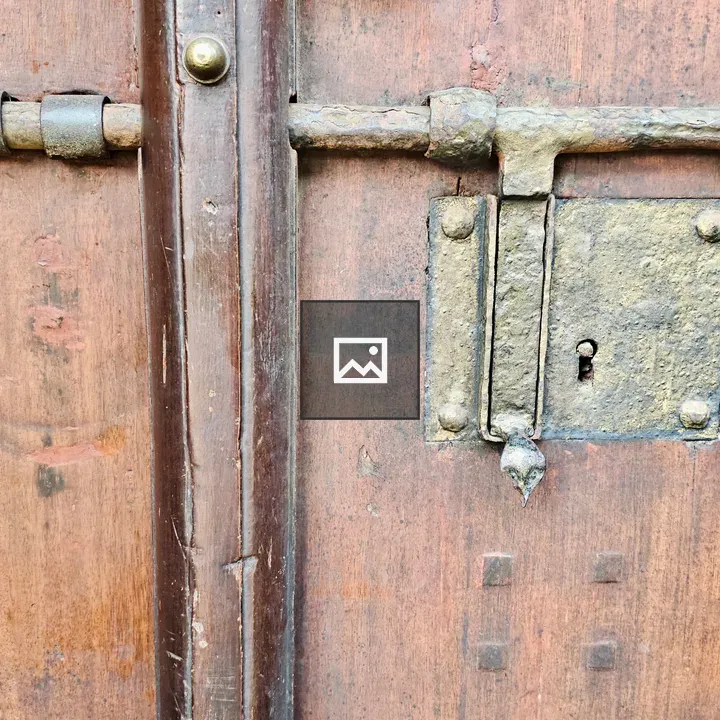 Close-up of wooden door with latch