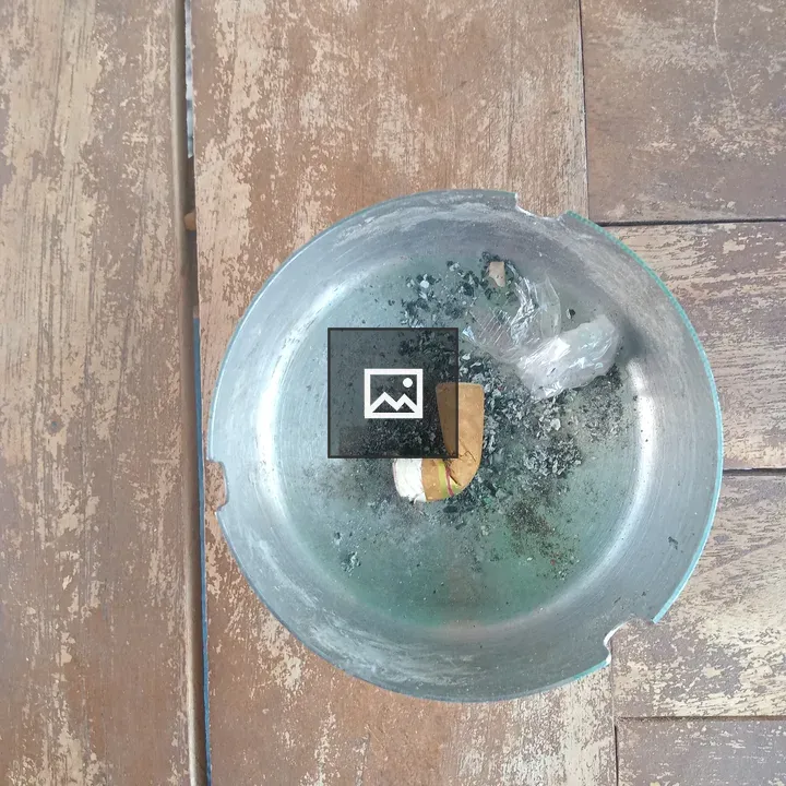 Small Cigarette in Ashtray