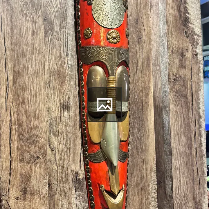 Tribal mask on wooden wall
