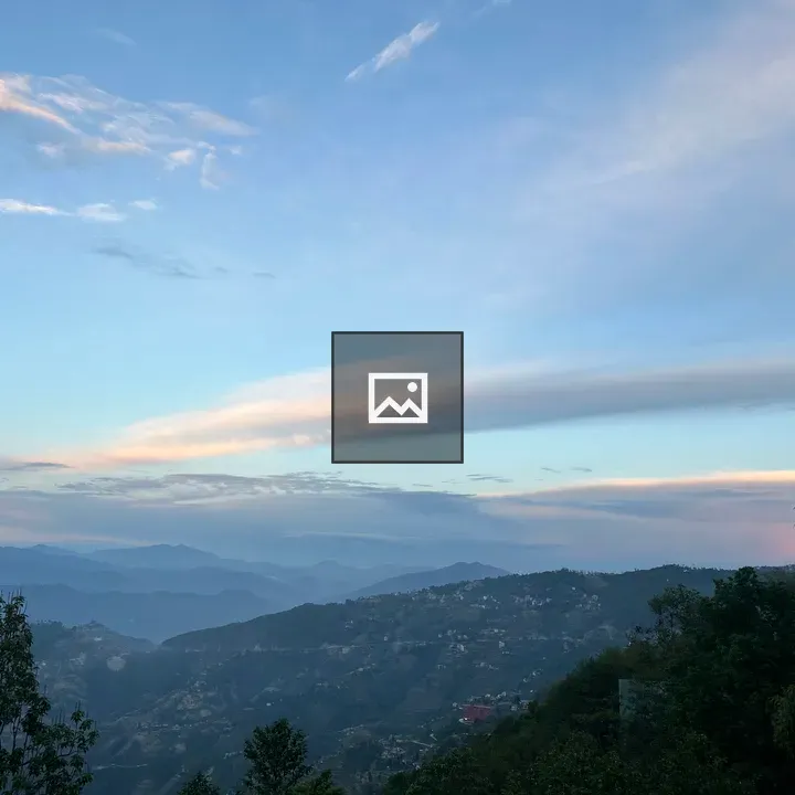 Rolling green hills at sunset