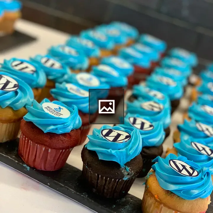 Cupcakes with blue frosting and logos