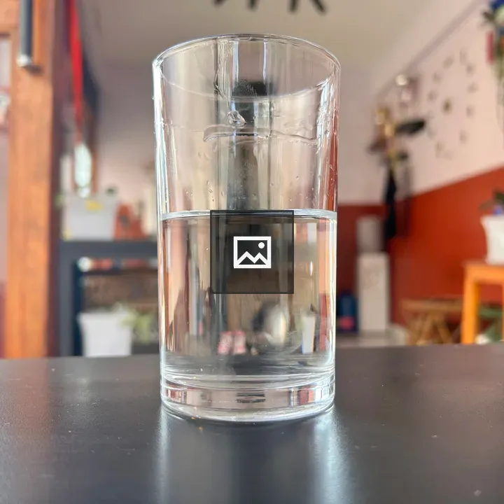 Cup of water on table