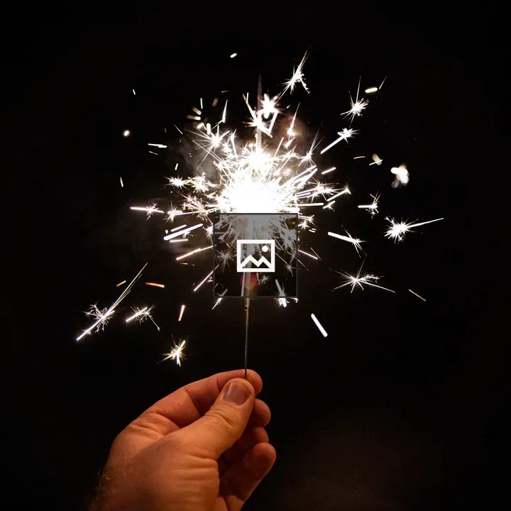 Single sparkler firework at night