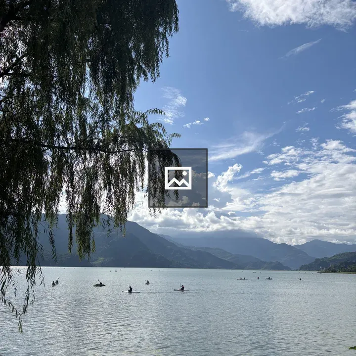 Lakeside Kayakers with Mountains