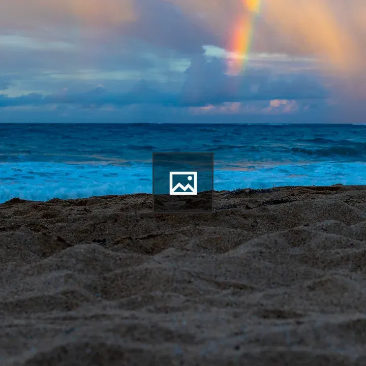 Rainbow Over Ocean and Beach