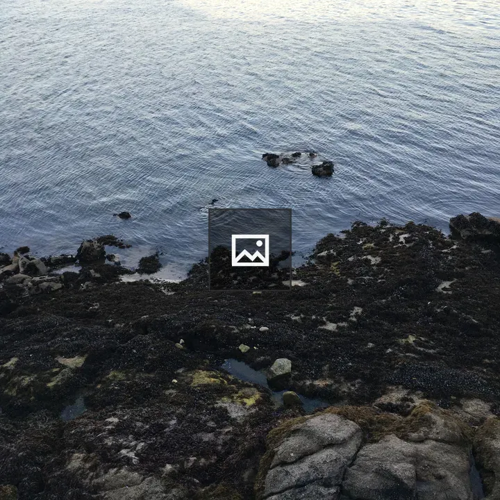 Rocky coastline at blue water