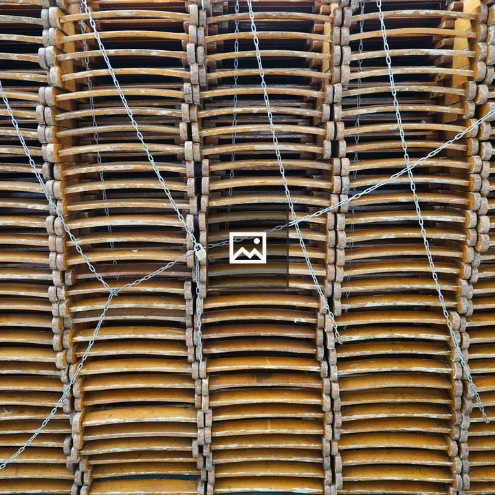 Chairs stacked neatly with chains