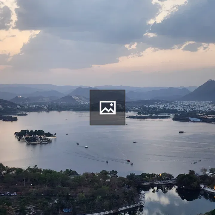 Hilltop view of Udaipur lake and mountains