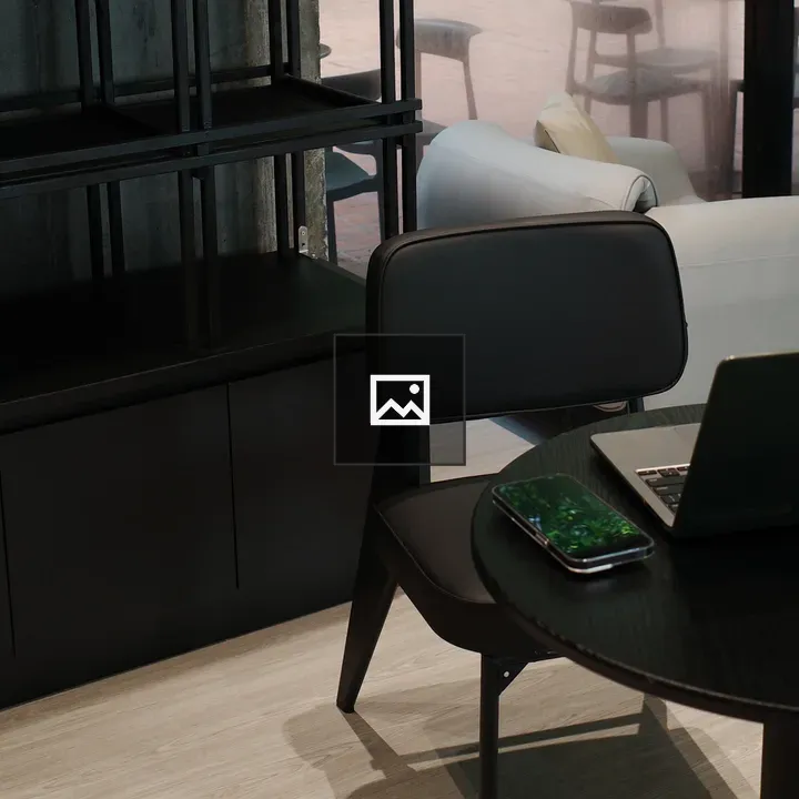 Sleek black table with laptop
