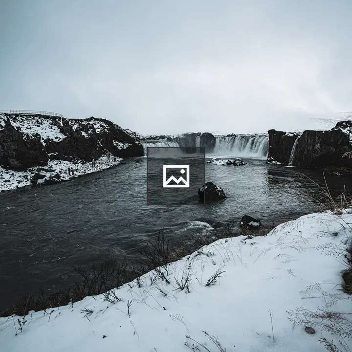 Snowy landscape with waterfall