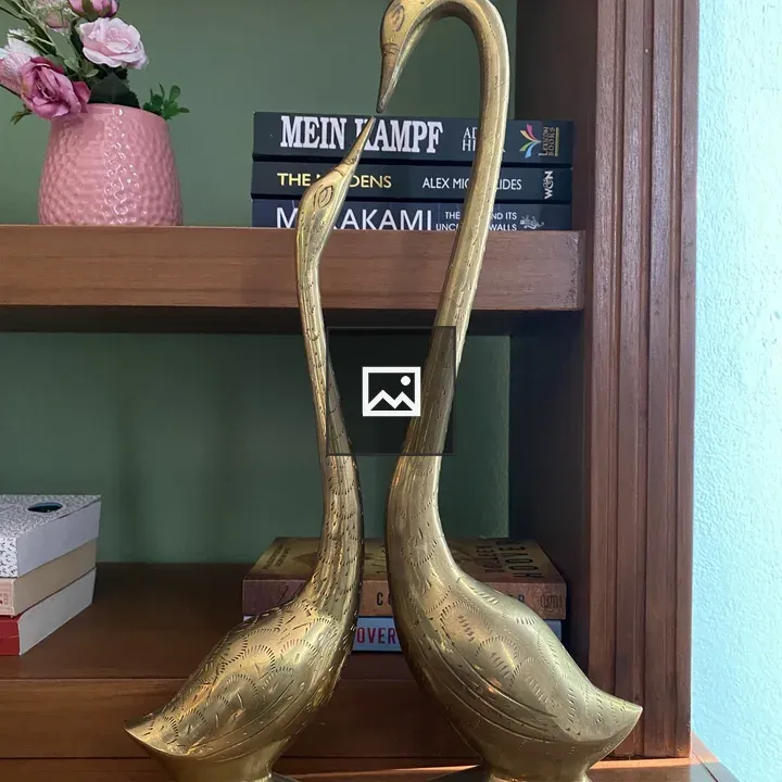 Brass Crane Sculptures on Shelf