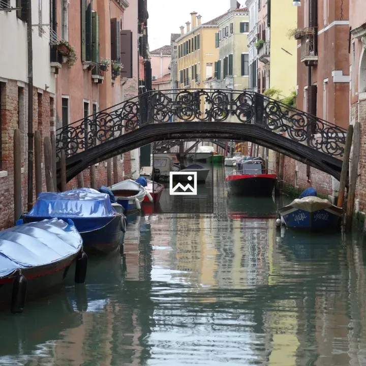 Venice Canal with Boats and Bridge