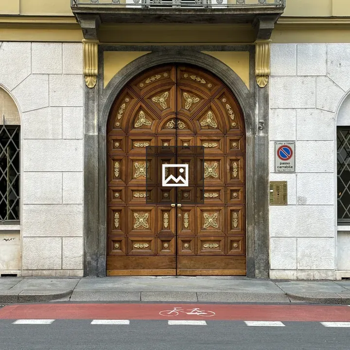 Large wooden door on Torino street