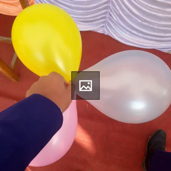 Hand with three balloons