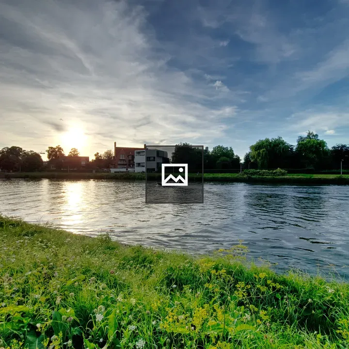 Sunset over Leie Canal with Boat