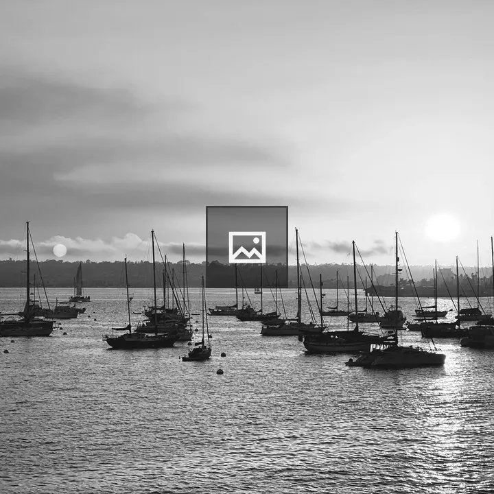 Sail boats off the shore