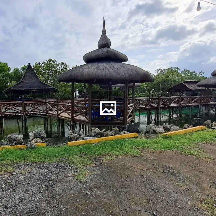 Waterfront with thatched pavilions