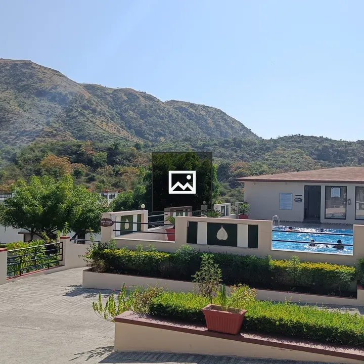 Outdoor pool with surrounding greenery