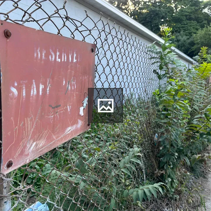 Old Reserved Parking Sign