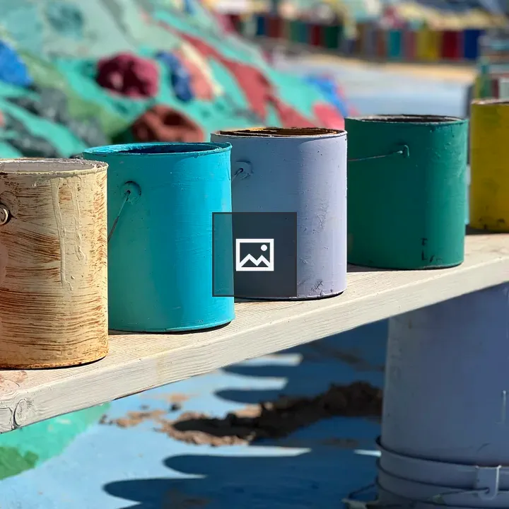 Row of rainbow paint cans