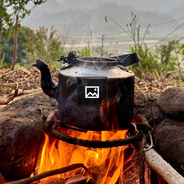 Kettle Over Fire in Nature Scene