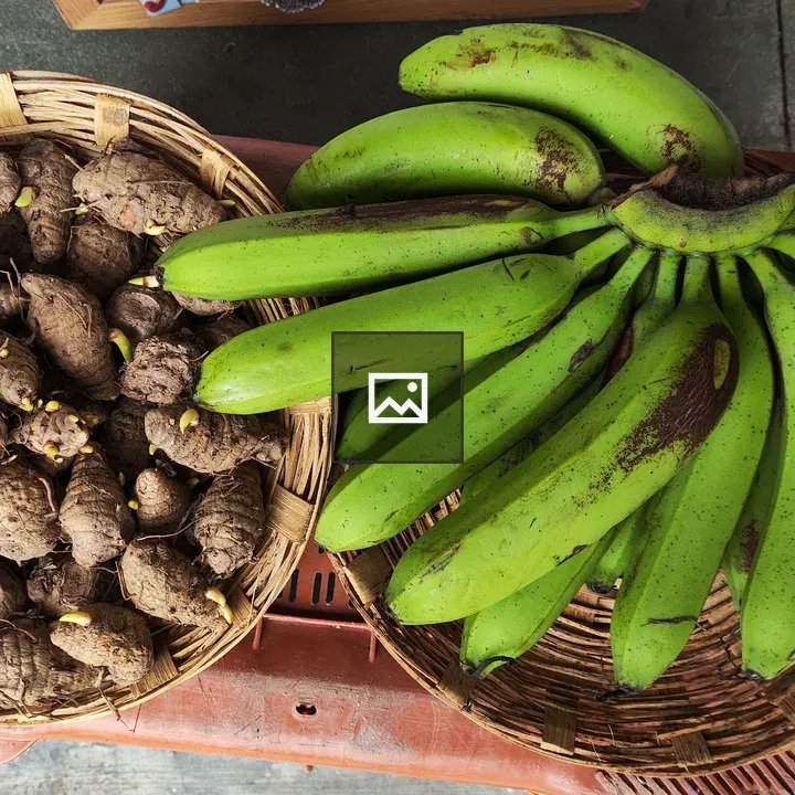 Yellow turmeric sticks and green banana