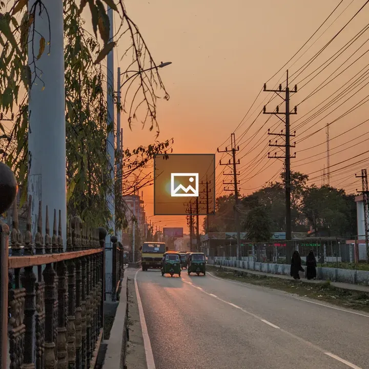 Sunset Street with Vehicles and Power Lines