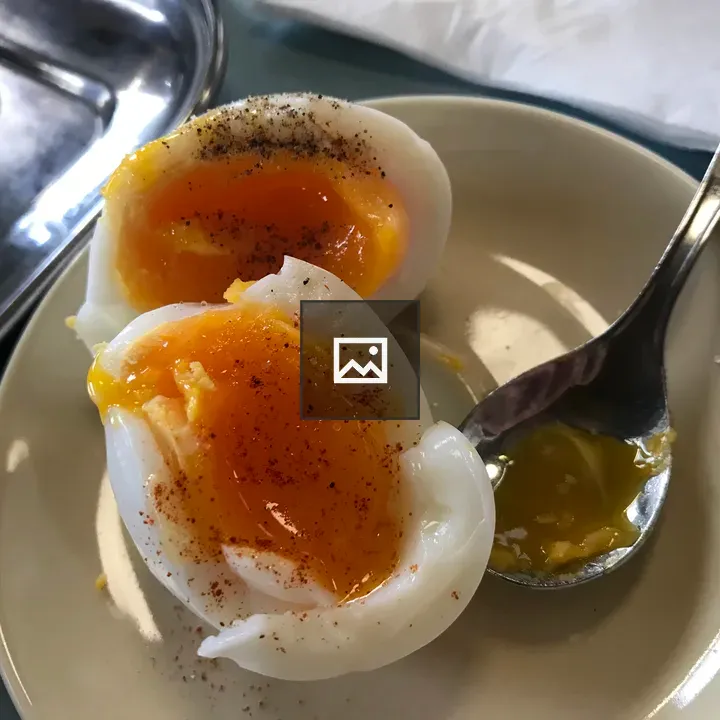 Soft-boiled egg halves on plate