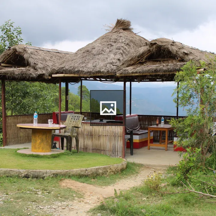 Thatched gazebo with round table