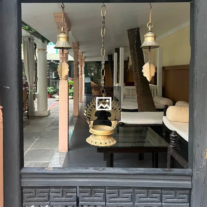 Carved doorway with patio seating