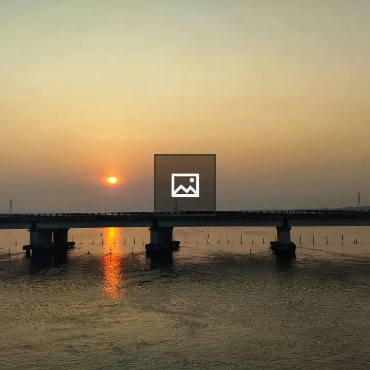 Sunrise over Bridge and Water