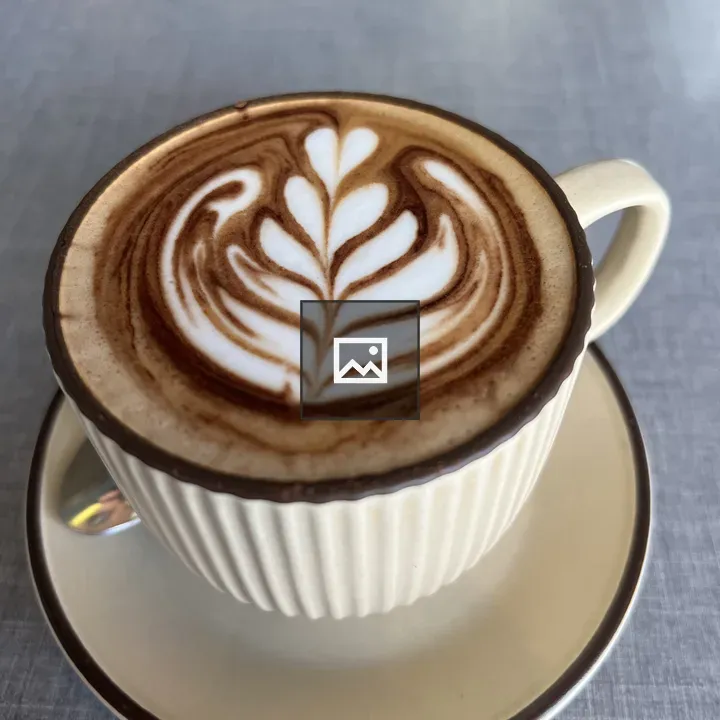 Cup of cappuccino with leaf design