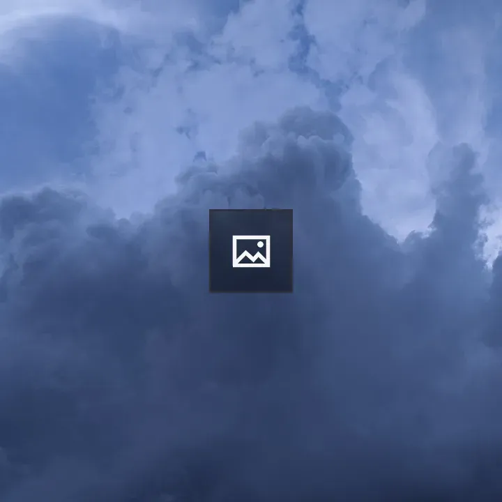Dramatic Cloudy Sky Over Blue Background