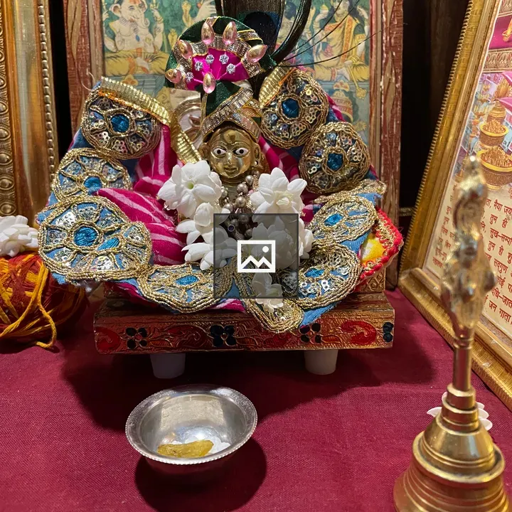 Krishna Statue with Floral Adornments