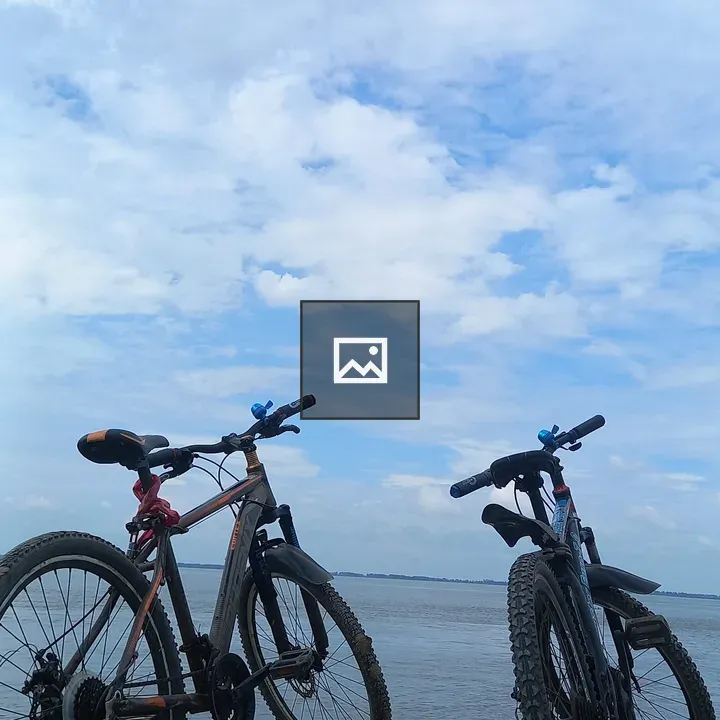 Two bicycles by the water