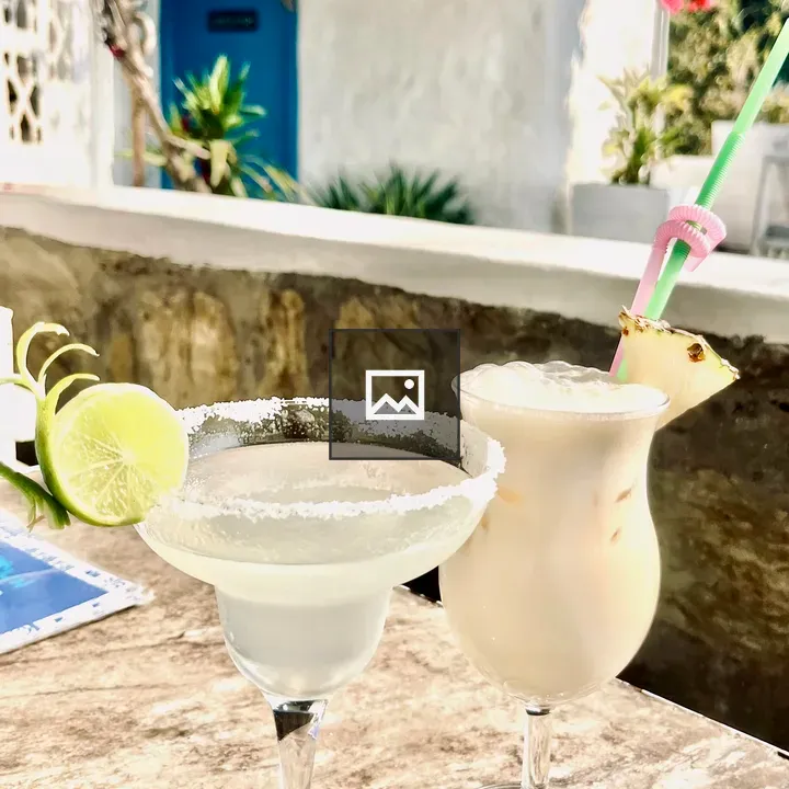 Two drinks on tablecloth