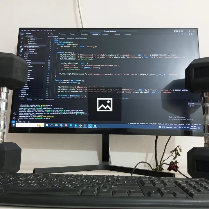 Dumbbells and Keyboard on Desk