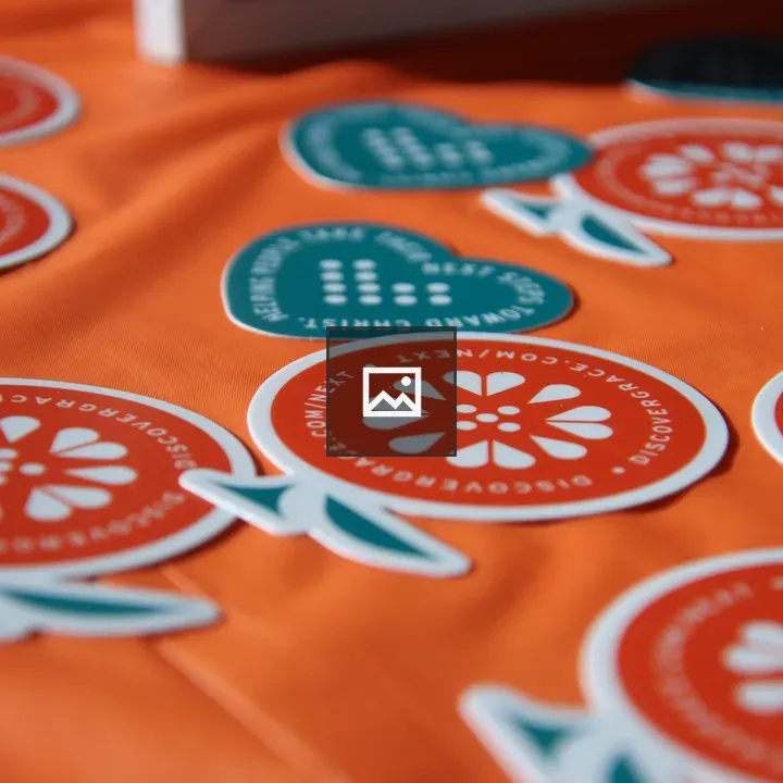 Close-up of orange and heart stickers