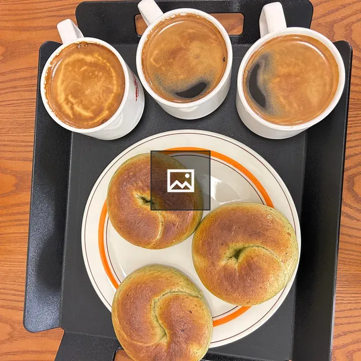 Three cups of coffee and bagels