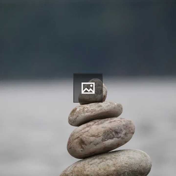 Rocks stacked on a larger rock