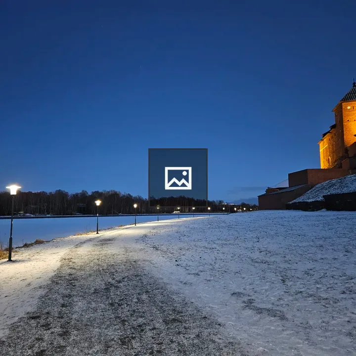 Snowy walkway with streetlights